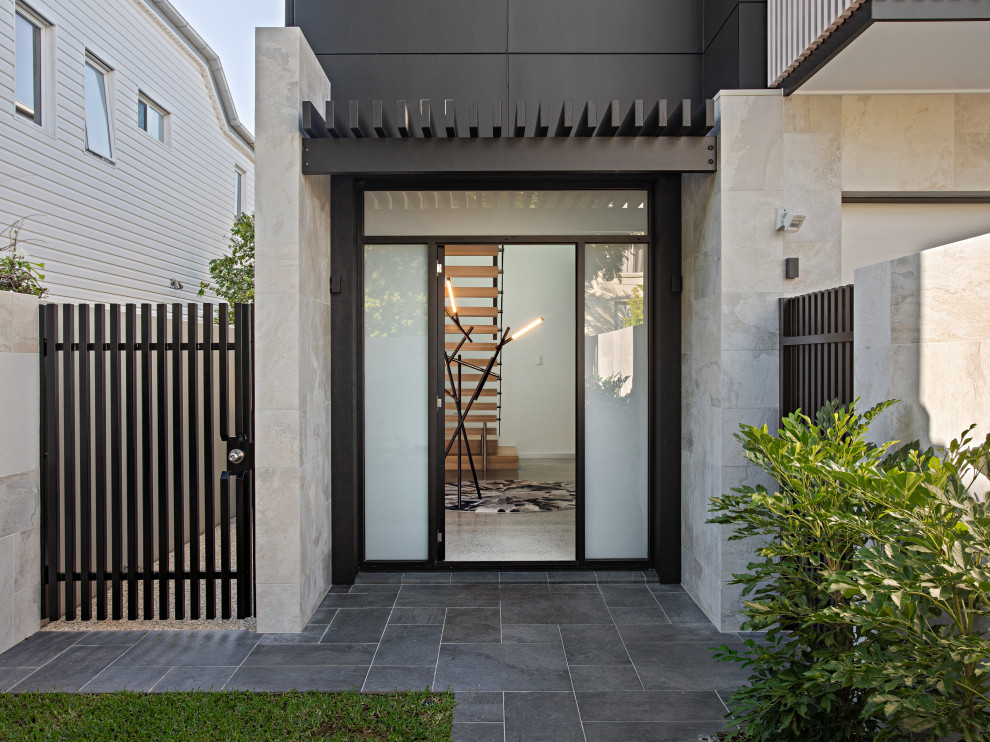 Photo of a mid-sized modern two-storey grey house exterior in Brisbane.