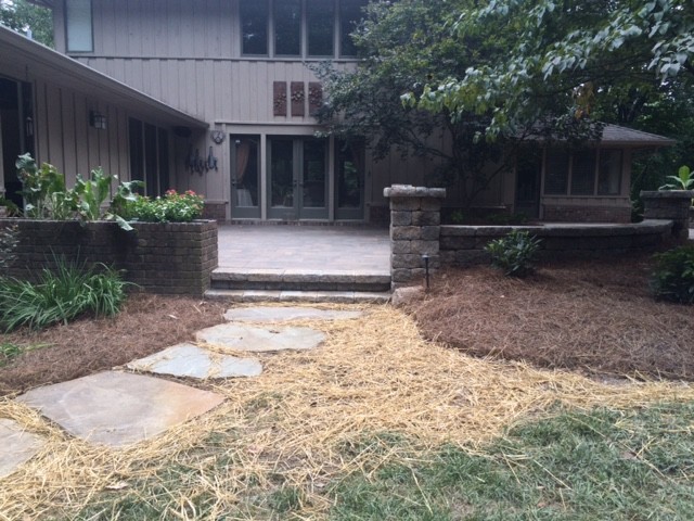 Large transitional backyard concrete paver patio photo with no cover