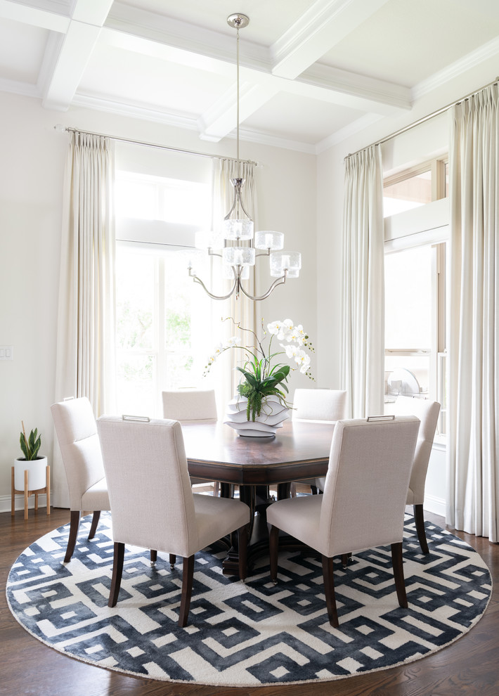 Photo of a traditional dining room in Dallas with beige walls, dark hardwood floors and no fireplace.