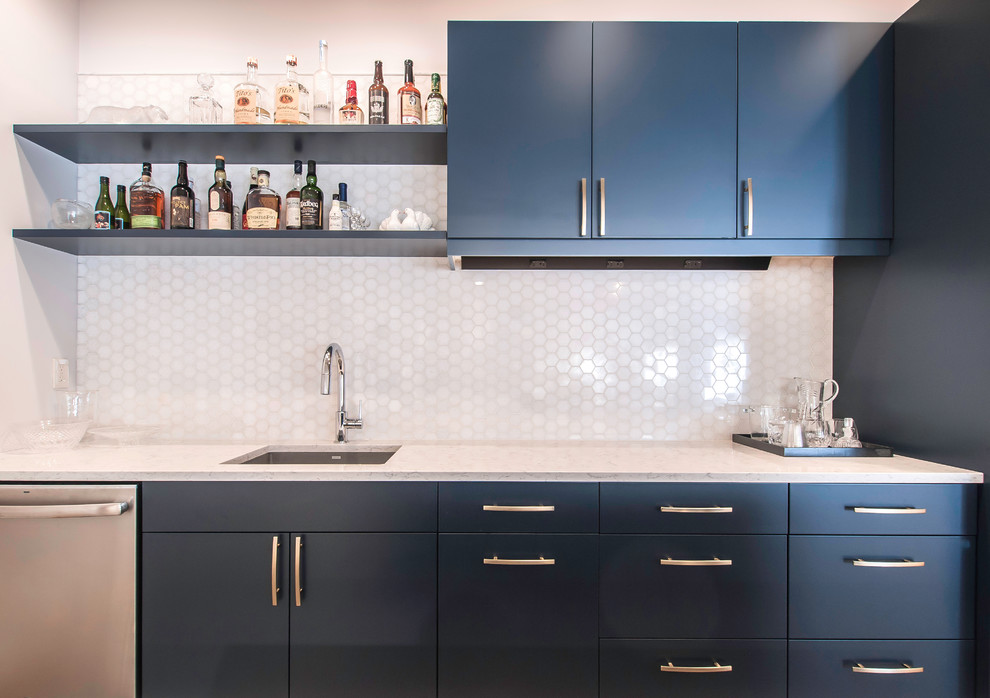 Design ideas for a small contemporary galley wet bar in Cincinnati with an undermount sink, flat-panel cabinets, blue cabinets, quartz benchtops, white splashback, mosaic tile splashback, vinyl floors, grey floor and white benchtop.