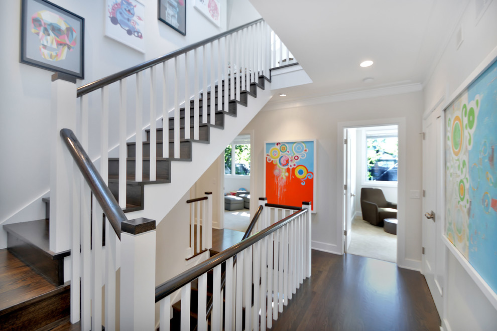 Large contemporary wood straight staircase in Chicago with wood risers.
