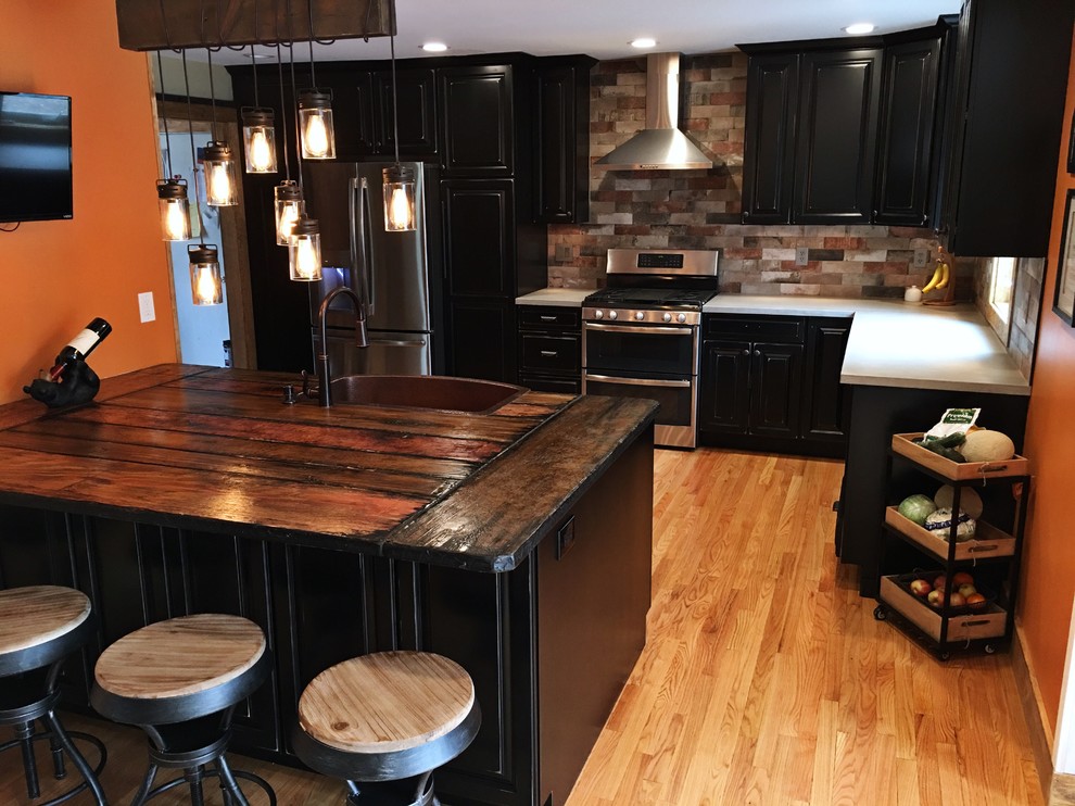Kitchen - rustic kitchen idea in New York with concrete countertops