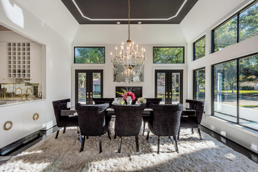 Photo of a transitional dining room in Dallas with white walls and dark hardwood floors.