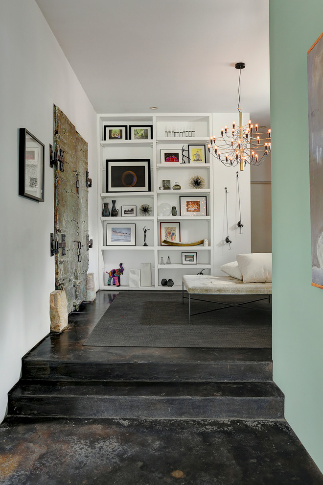 Mid-sized foyer in Houston with white walls, concrete floors and a medium wood front door.