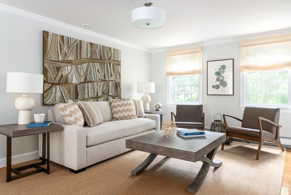 This is an example of a mid-sized transitional open concept living room in Boston with grey walls, medium hardwood floors, brown floor and no fireplace.