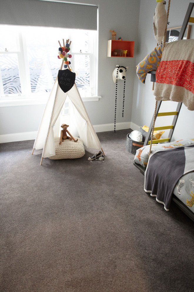 Design ideas for a mid-sized contemporary gender-neutral kids' bedroom for kids 4-10 years old in Melbourne with grey walls and carpet.
