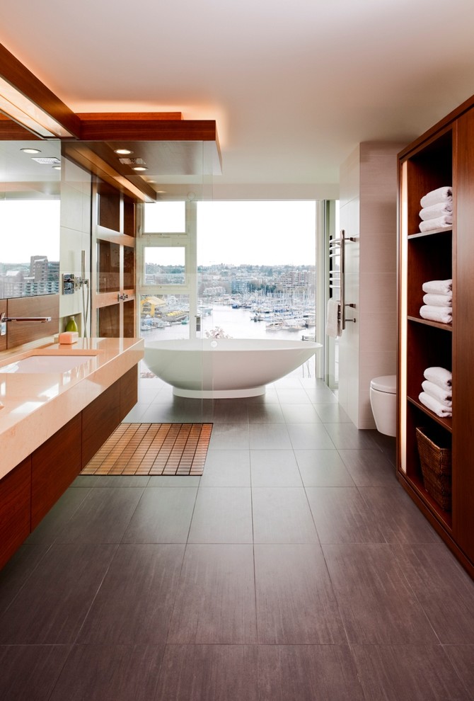 Contemporary bathroom in Vancouver with a freestanding tub, an open shower and an open shower.