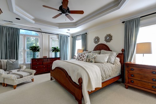 traditional bedroom with tradtional bedroom suits and grey curtains