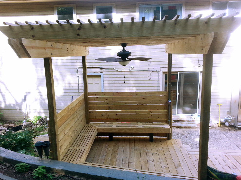 Inspiration for a large backyard deck remodel with a pergola