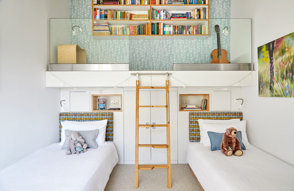 Inspiration for a mid-sized midcentury gender-neutral kids' bedroom for kids 4-10 years old in Surrey with white walls, carpet and beige floor.