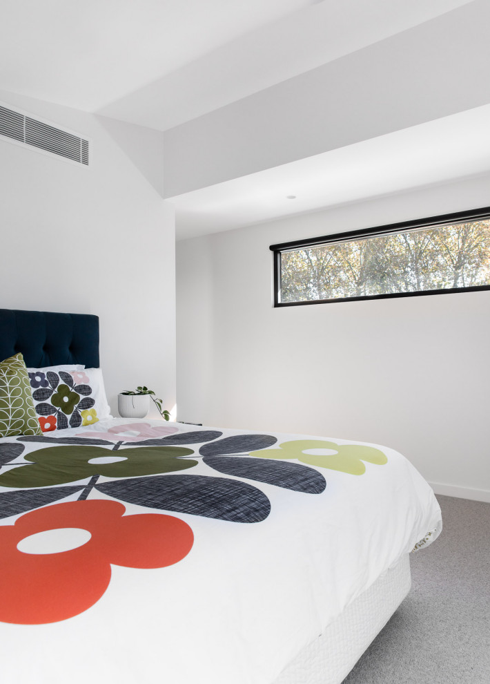 Design ideas for a mid-sized contemporary master bedroom in Sydney with white walls, carpet and beige floor.