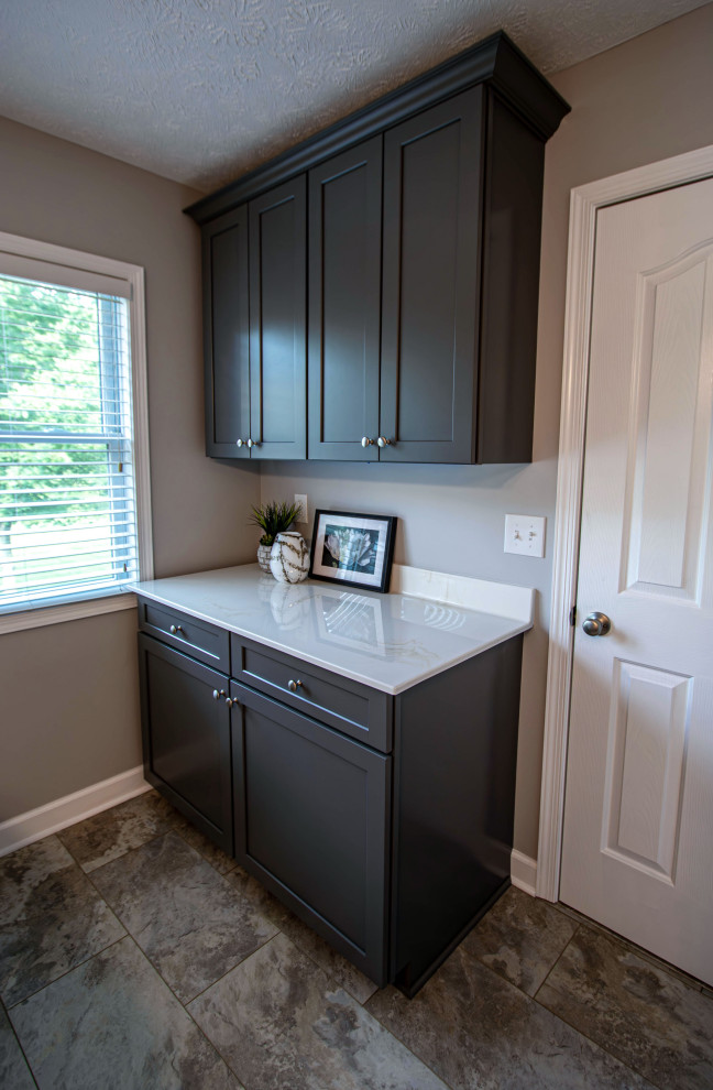 Small transitional galley utility room in Cleveland with flat-panel cabinets and grey cabinets.
