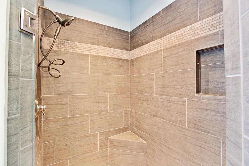 Example of a mid-sized transitional master beige tile and ceramic tile travertine floor freestanding bathtub design with raised-panel cabinets, distressed cabinets, blue walls, an undermount sink and marble countertops