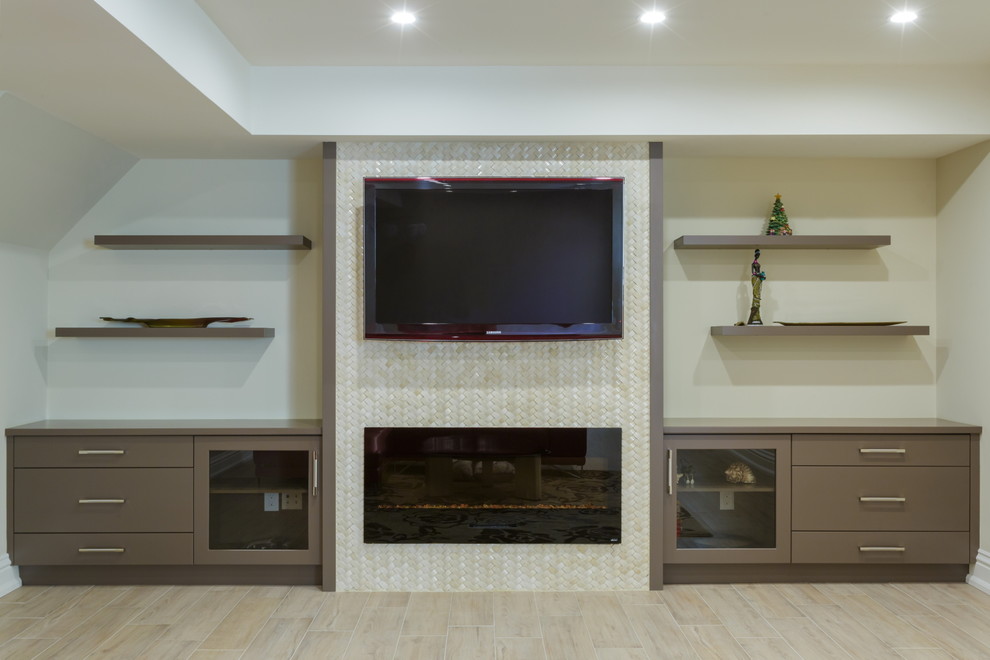 Large contemporary fully buried basement in Toronto with white walls, light hardwood floors, a ribbon fireplace and a tile fireplace surround.