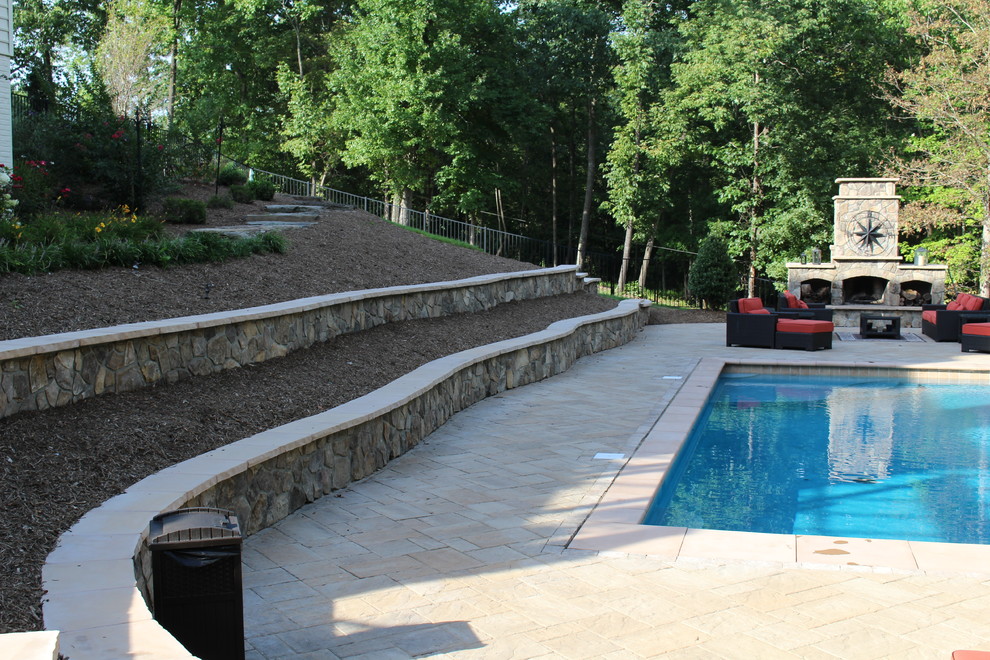 Inspiration for a mid-sized rustic backyard concrete paver and rectangular natural home design remodel in DC Metro
