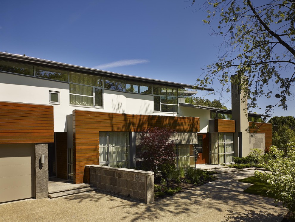 Photo of a contemporary exterior in Toronto with wood siding.