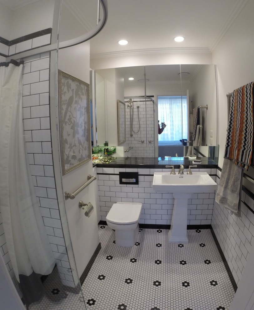 Inspiration for a small traditional master bathroom in Melbourne with a pedestal sink, glass-front cabinets, engineered quartz benchtops, a corner shower, a one-piece toilet, white tile, ceramic tile, white walls and mosaic tile floors.