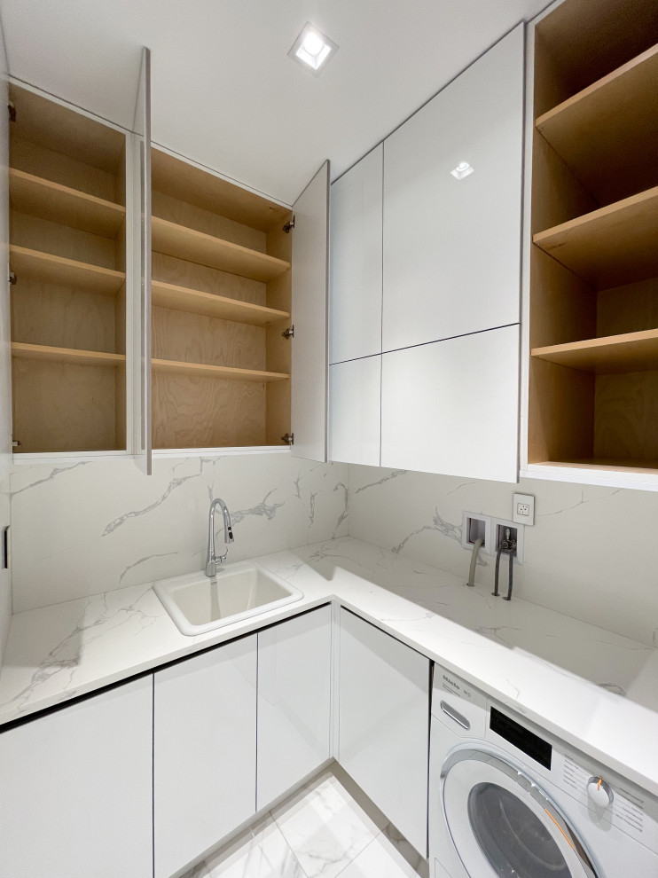 Mid-sized modern l-shaped dedicated laundry room in Vancouver with open cabinets and white cabinets.
