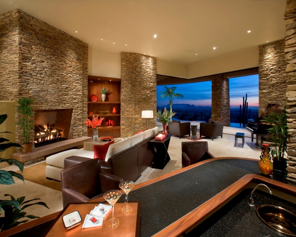 Photo of a large contemporary open concept living room in Phoenix with a home bar, white walls, travertine floors, a standard fireplace, a stone fireplace surround and no tv.