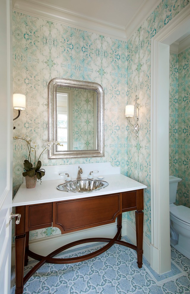 Inspiration for a small traditional bathroom in Dallas with dark wood cabinets, a two-piece toilet, multi-coloured tile, mosaic tile, blue walls, marble floors, a drop-in sink, marble benchtops and furniture-like cabinets.