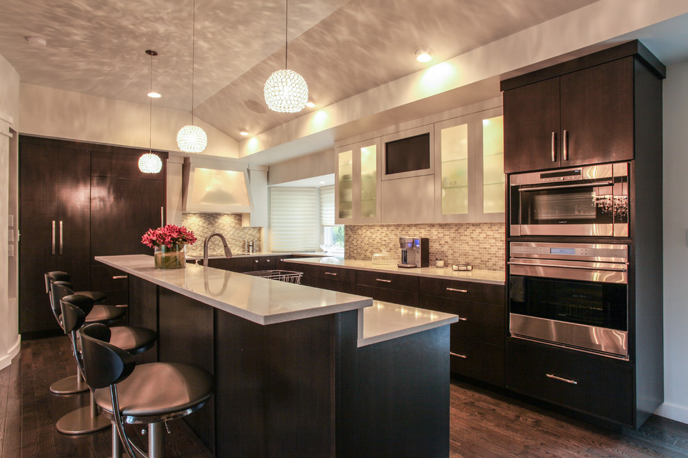 Large minimalist u-shaped dark wood floor eat-in kitchen photo in Indianapolis with an undermount sink, flat-panel cabinets, dark wood cabinets, quartz countertops, brown backsplash, glass tile backsplash, stainless steel appliances and an island