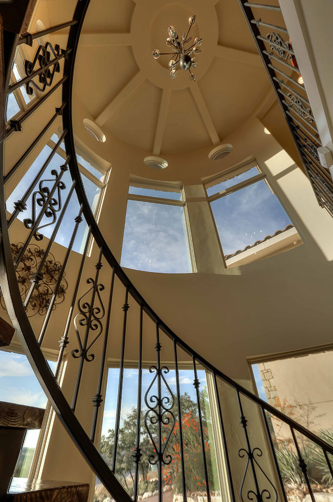 Design ideas for a mediterranean spiral staircase in Austin with metal risers.