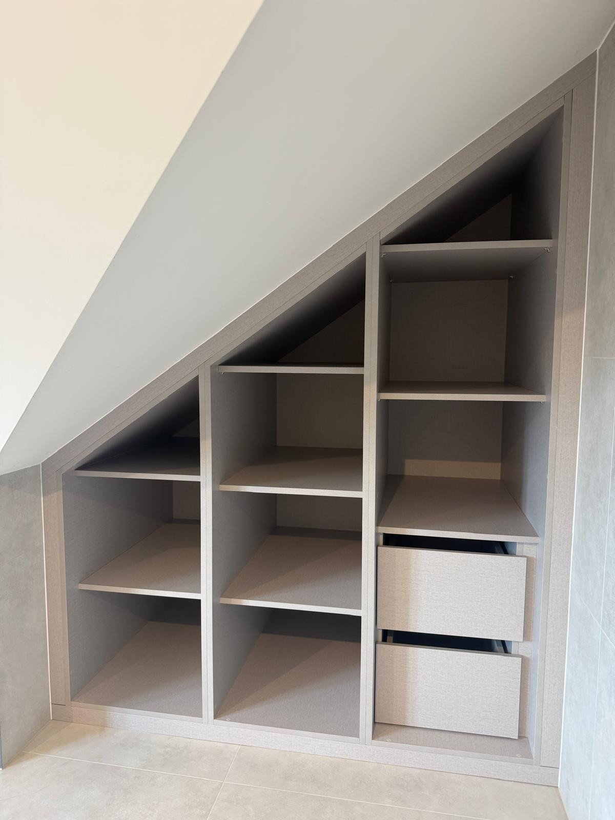 Custom-designed fitted wardrobes and storage solutions for loft rooms and sloping ceilings.