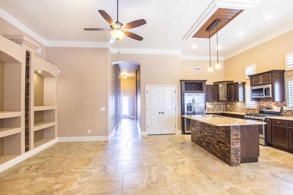 Home design - mid-sized transitional u-shaped ceramic tile home design idea in Austin with a double-bowl sink, raised-panel cabinets, white cabinets, granite countertops, multicolored backsplash, ceramic backsplash, stainless steel appliances and an island