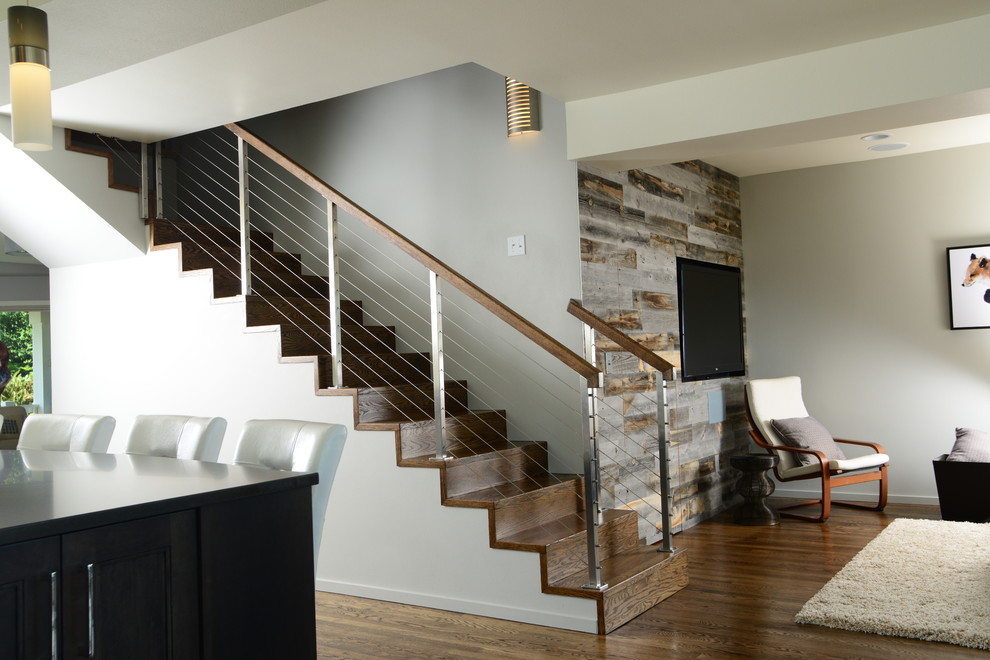 Mid-sized modern wood straight staircase in Seattle with wood risers.