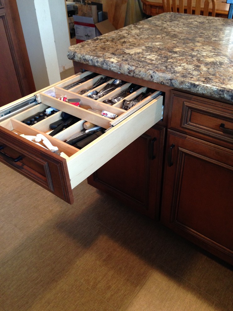 Inspiration for a small transitional u-shaped eat-in kitchen remodel with an undermount sink, flat-panel cabinets, medium tone wood cabinets, laminate countertops and a peninsula