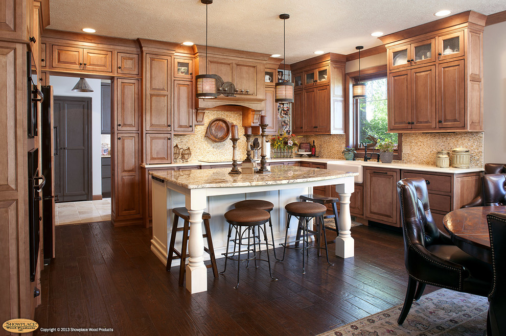 Inspiration for a rustic l-shaped dark wood floor and brown floor eat-in kitchen remodel with a farmhouse sink, raised-panel cabinets, light wood cabinets, granite countertops, multicolored backsplash, mosaic tile backsplash, stainless steel appliances and an island