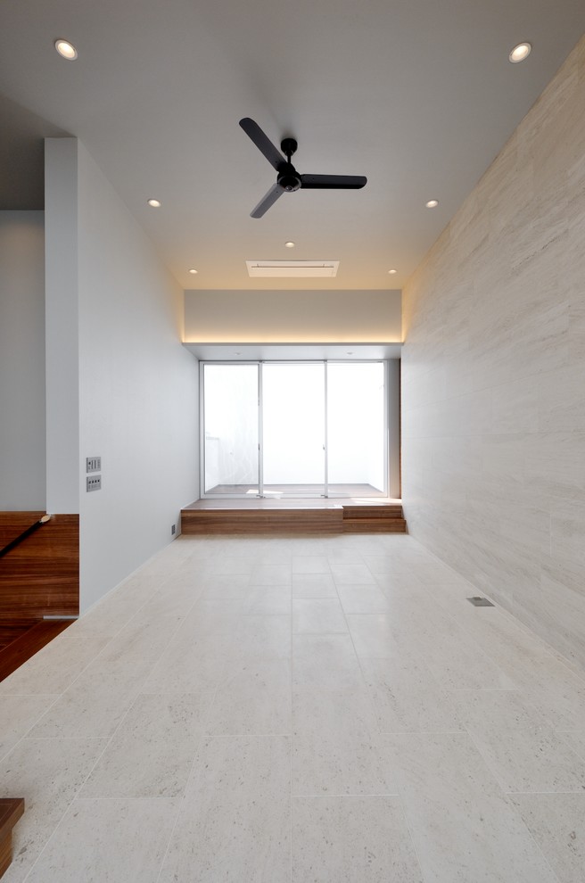 Inspiration for a modern enclosed living room in Tokyo Suburbs with beige walls, limestone floors, no fireplace and beige floor.