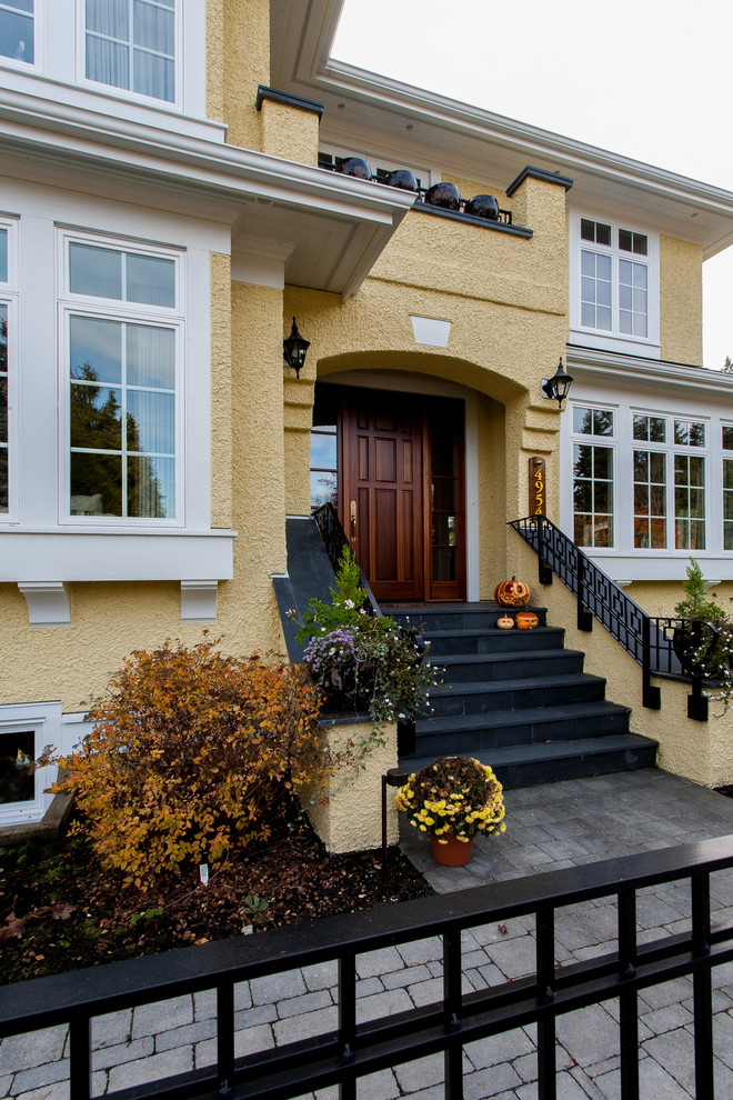 Inspiration for a traditional front door in Vancouver with a single front door and a medium wood front door.