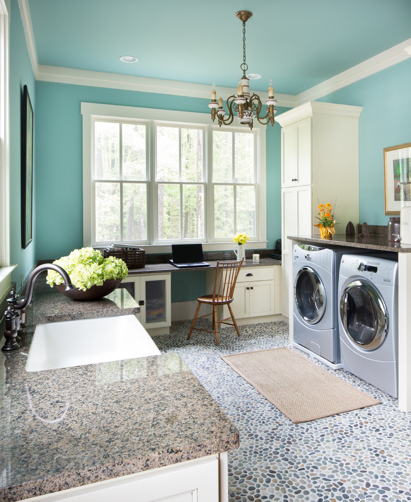 Inspiration for a large transitional u-shaped utility room in Charleston with a farmhouse sink, shaker cabinets, beige cabinets, granite benchtops, blue walls, a side-by-side washer and dryer and multi-coloured floor.