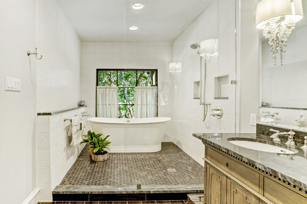 Bathroom - mid-sized transitional master white tile and porcelain tile porcelain tile, beige floor and double-sink bathroom idea in Austin with furniture-like cabinets, medium tone wood cabinets, a one-piece toilet, white walls, an undermount sink, quartzite countertops, green countertops and a freestanding vanity