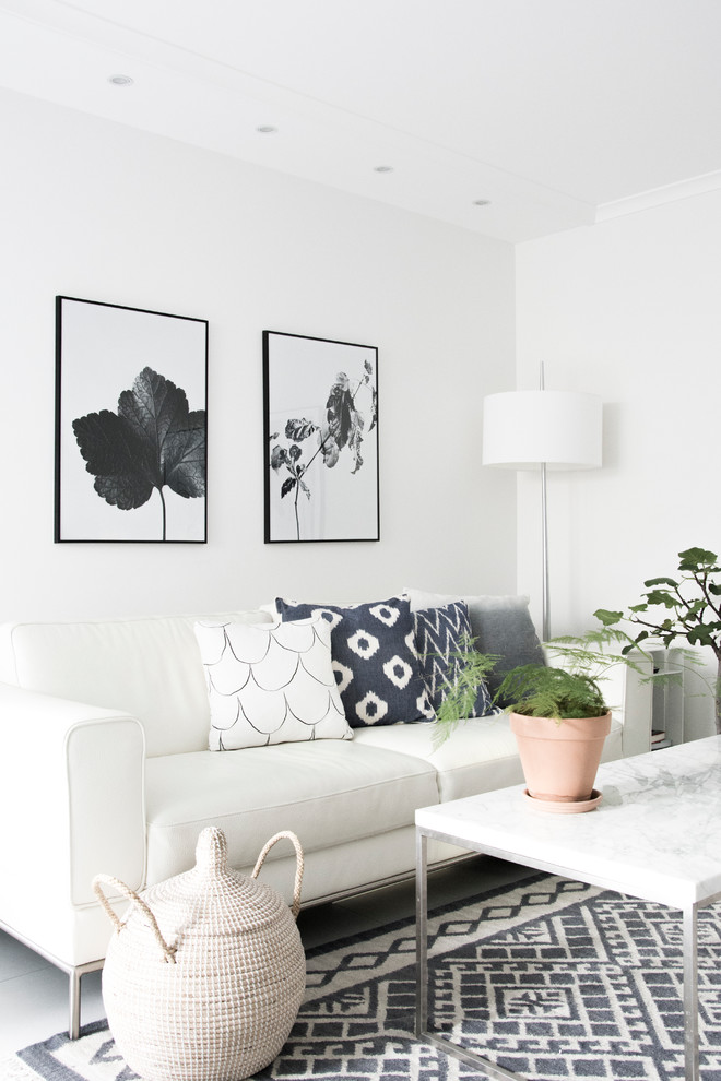 This is an example of a small scandinavian enclosed living room in Stockholm with white walls and no fireplace.