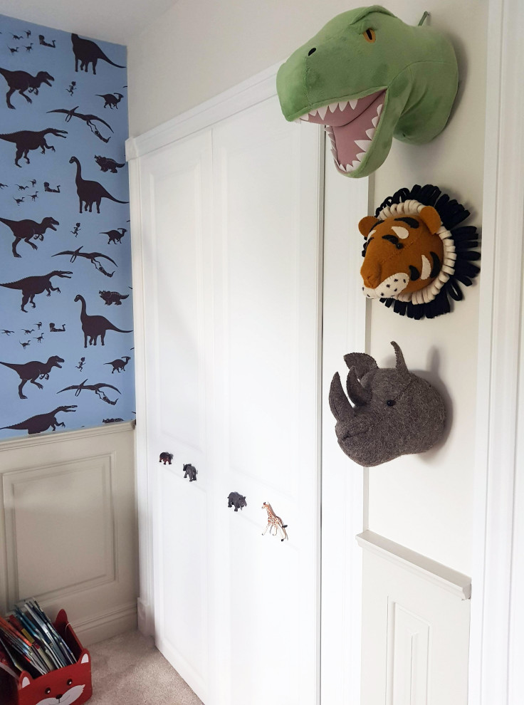 Modern toddler room in London with multi-coloured walls and wallpaper for boys.