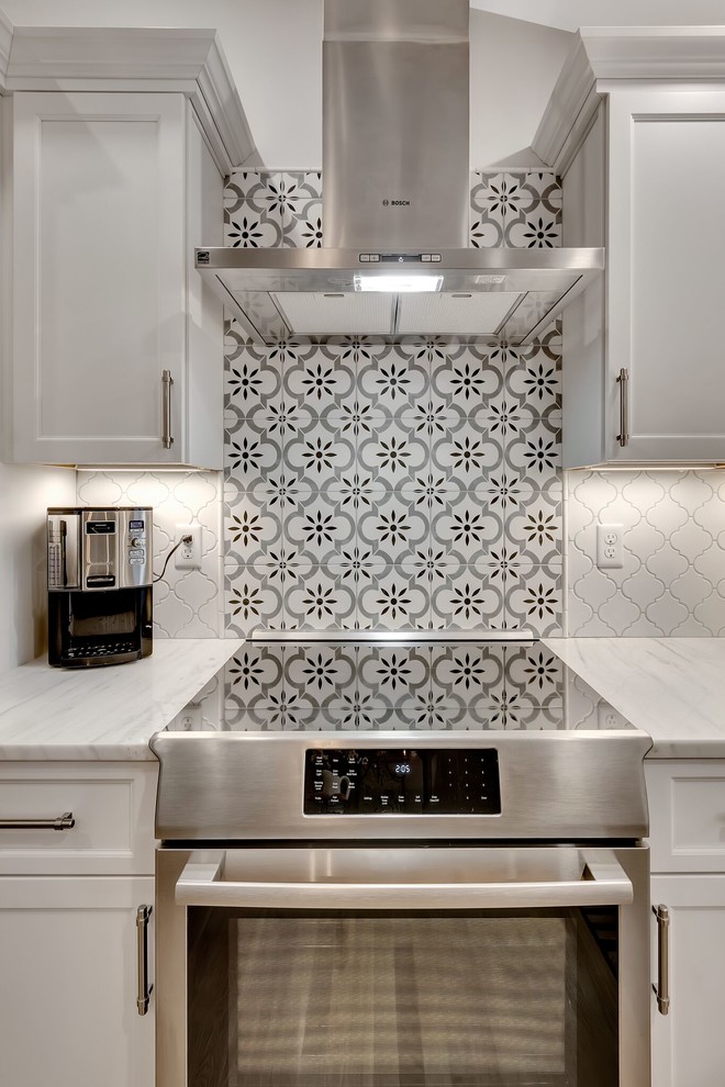 Eat-in kitchen - transitional light wood floor eat-in kitchen idea in Boston with an island