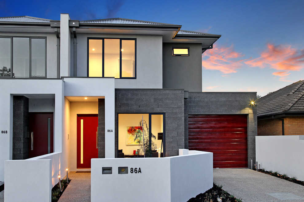 Mid-sized contemporary two-storey brick grey exterior in Melbourne.