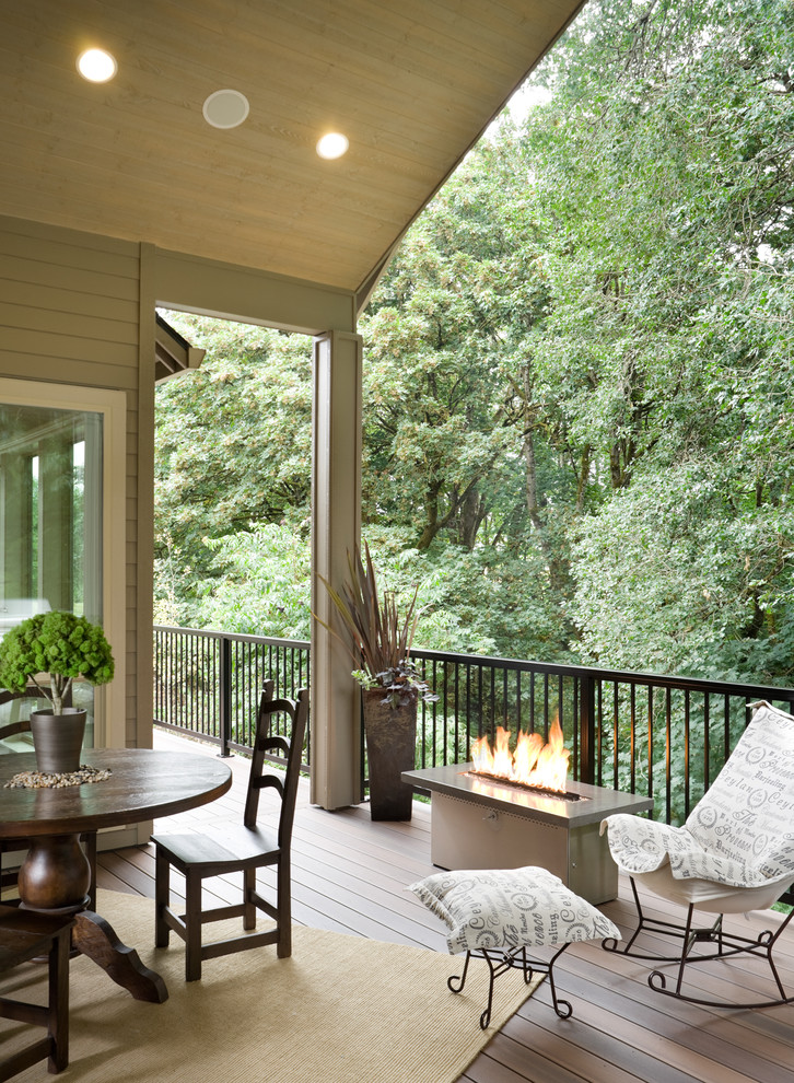 Inspiration for a transitional deck in Portland with a roof extension.