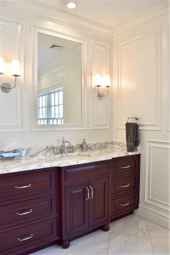 This is an example of a mid-sized traditional master bathroom in Philadelphia with furniture-like cabinets, dark wood cabinets, white walls, marble floors, an undermount sink, marble benchtops, grey floor and grey benchtops.