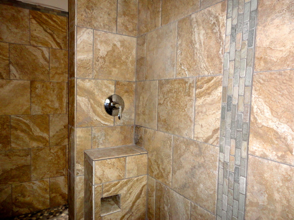 This is an example of a large contemporary master bathroom in Albuquerque with multi-coloured tile, ceramic tile and pebble tile floors.
