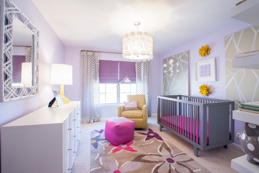 Photo of a transitional nursery for girls in Charlotte with purple walls, carpet and beige floor.