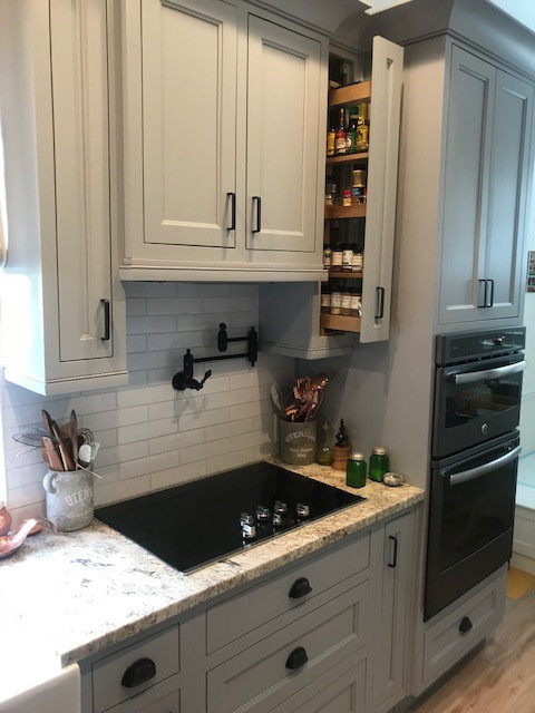 Example of a mid-sized transitional home design design in Miami
