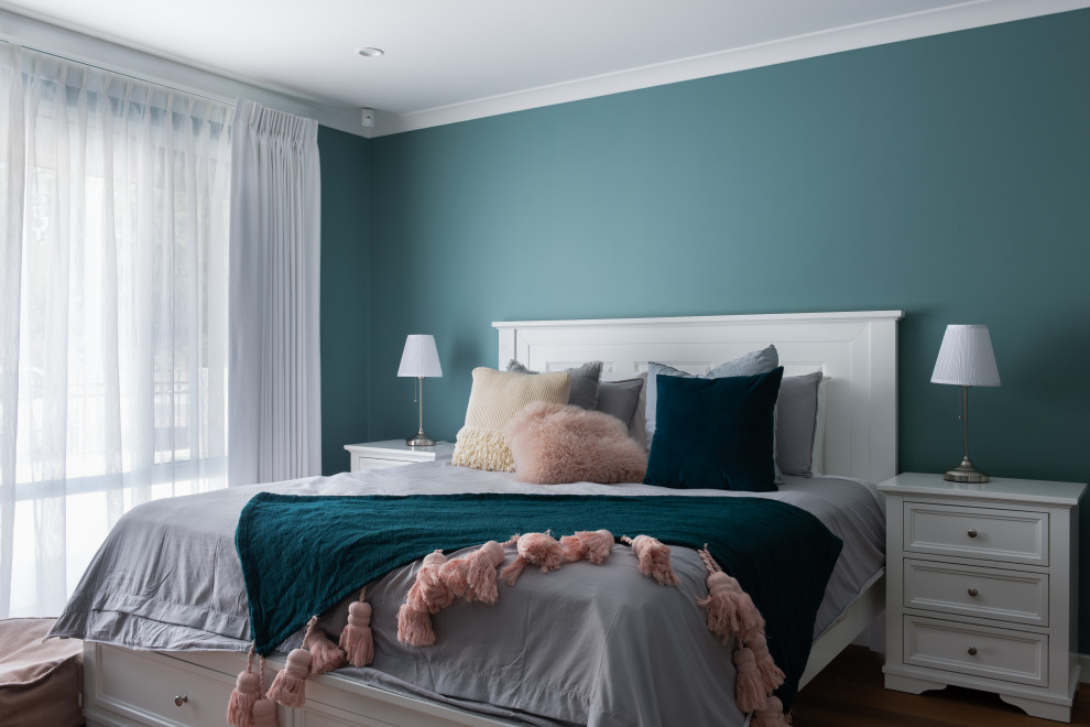 Photo of a transitional bedroom in Perth with blue walls.