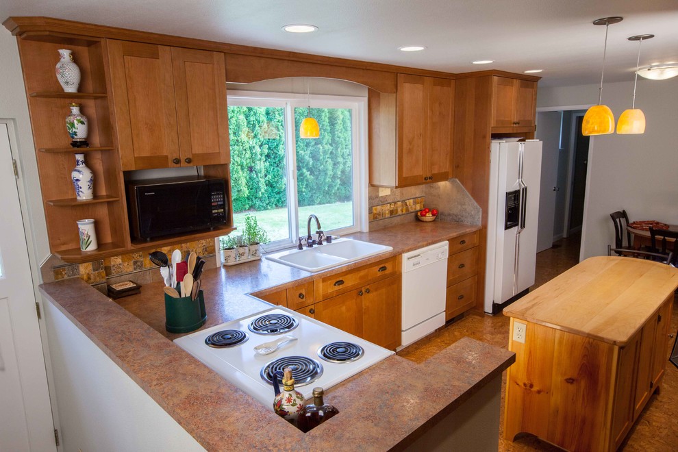 Mid-sized transitional l-shaped eat-in kitchen photo in Seattle with shaker cabinets, medium tone wood cabinets and an island