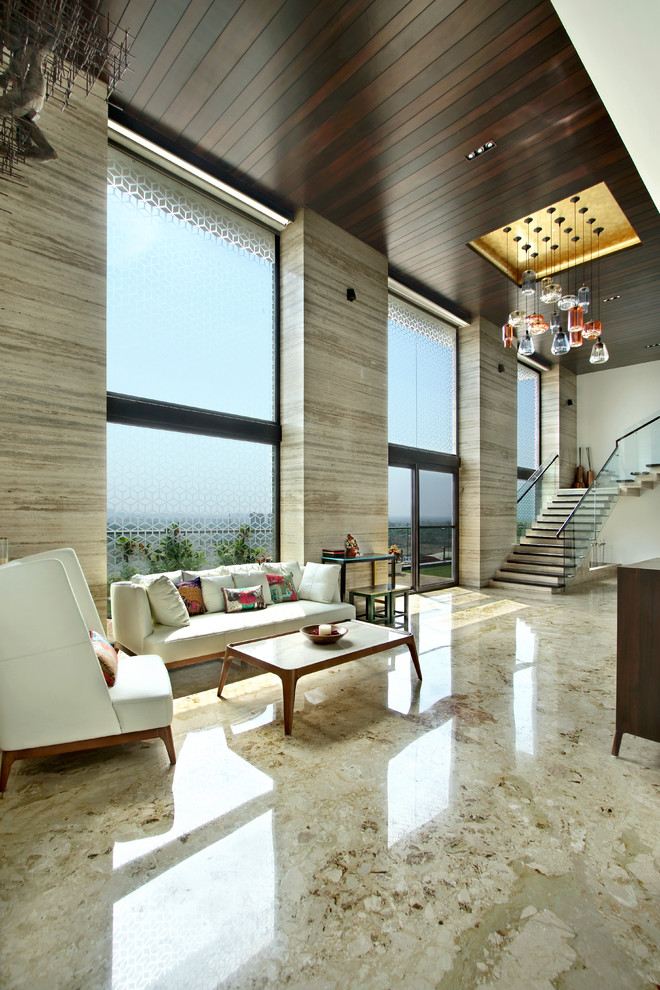 Large contemporary open concept living room in Other with marble floors.