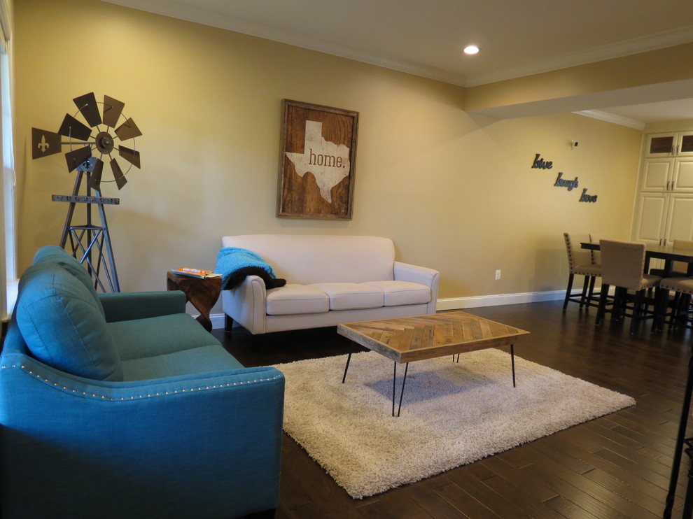 Example of a large transitional galley dark wood floor and brown floor kitchen design with a double-bowl sink, raised-panel cabinets, white cabinets, granite countertops, white backsplash, porcelain backsplash, stainless steel appliances and an island