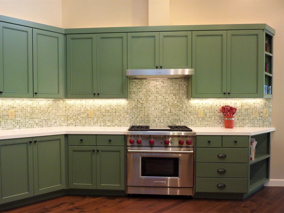 Design ideas for a large transitional eat-in kitchen in San Francisco with an undermount sink, shaker cabinets, green cabinets, quartz benchtops, green splashback, mosaic tile splashback, stainless steel appliances, medium hardwood floors, with island and white benchtop.