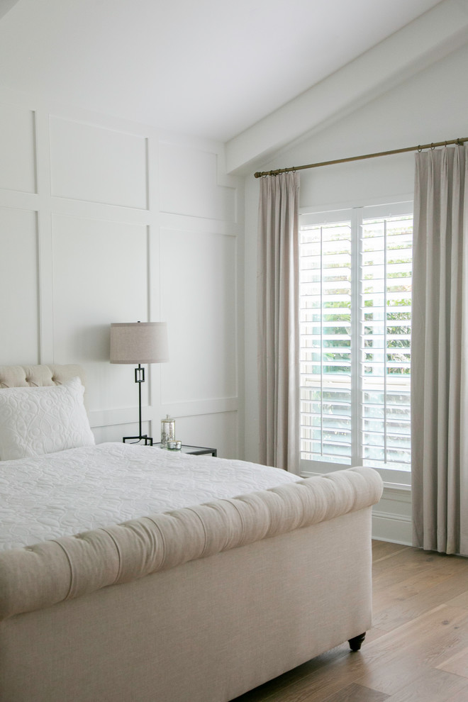 Photo of a large scandinavian master bedroom in Houston with grey walls, light hardwood floors and beige floor.